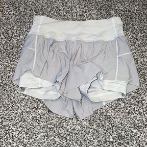 White Lululemon shorts with built in spandex. Size 4
